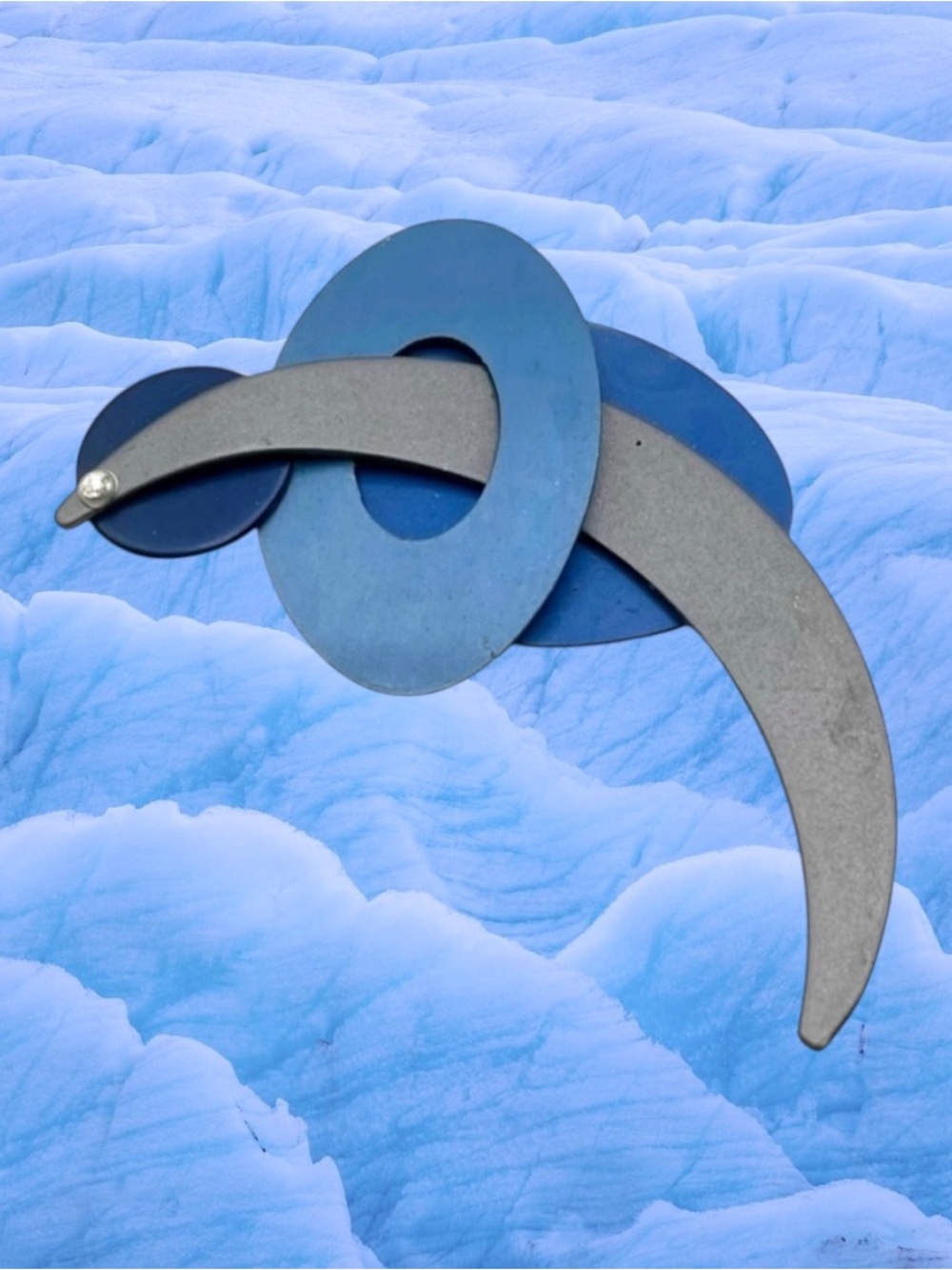 EROS by Q3 Abstract Oxidized Aluminum Dolphin Jumping Hoop Statement Brooch